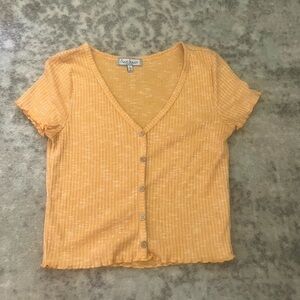 Cute yellow top with buttons and frilly sleeves and hem